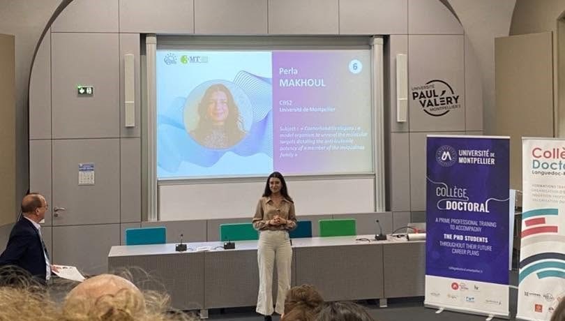 Perla Makhoul on stage at the My Thesis in 3 Minutes regional final in Montpellier, in front of her title slide